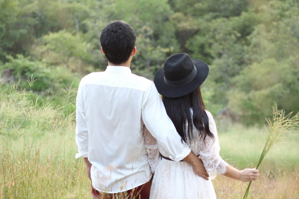 couple in grass, Targeted Love: 10 Techniques For Husbands To Appreciate Wives