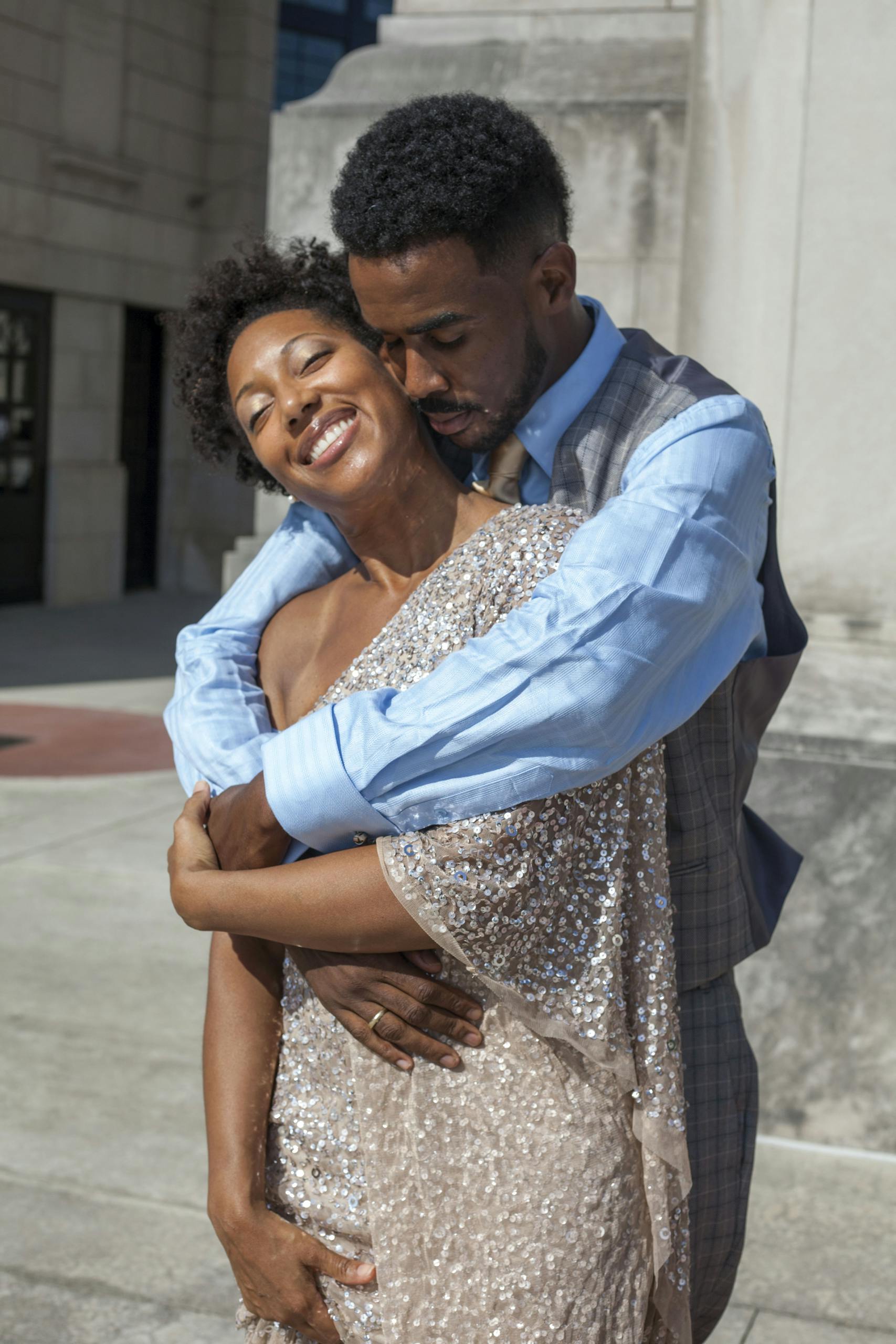 A joyful couple embracing outdoors in Atlanta, showcasing warmth and love.
